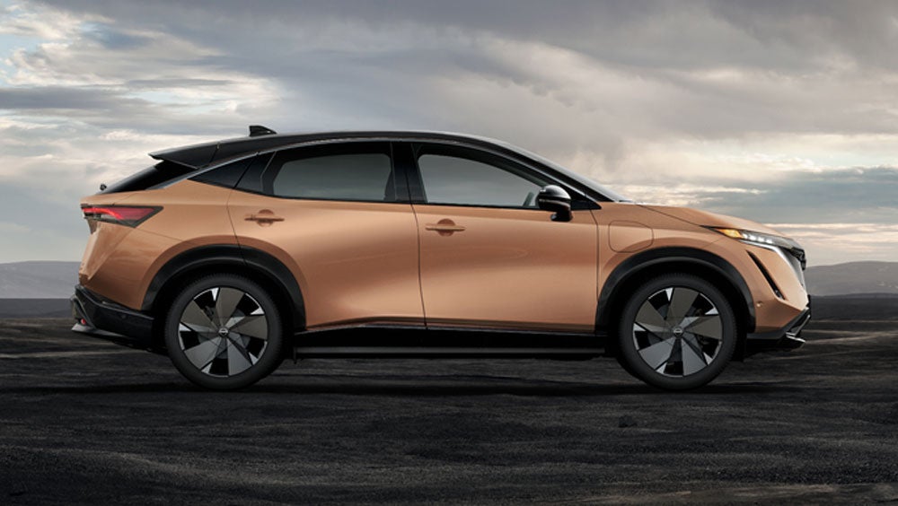 Nissan ARIYA in Sunrise Copper in dramatic landscape | Nissan of Cookeville in Cookeville TN